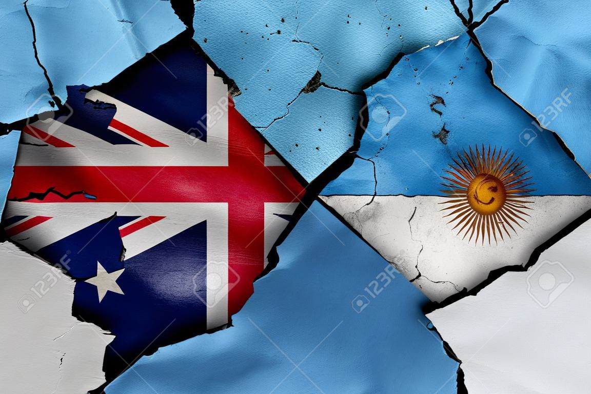 flags of Australia and Argentina painted on cracked wall