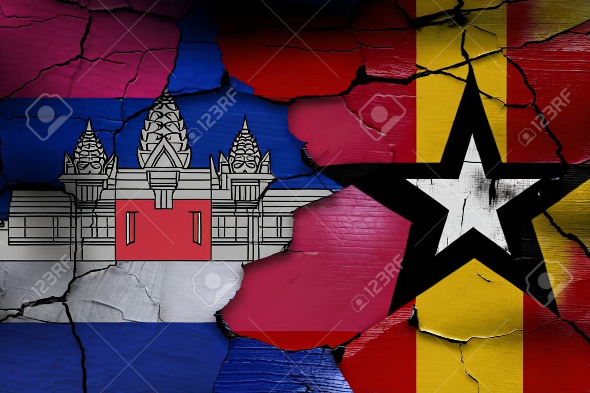 flags of Cambodia and East Timor painted on cracked wall