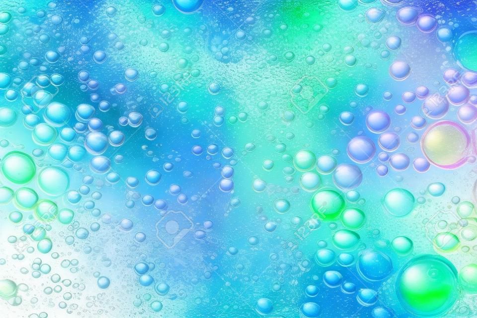Burbujas de colores de aceite mezclado con agua