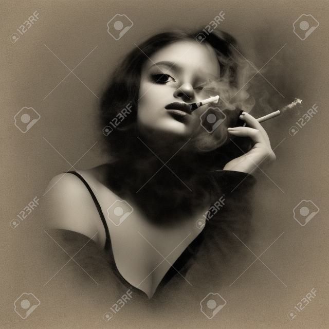 Young woman smoking a cigarette. Monochrome portrait