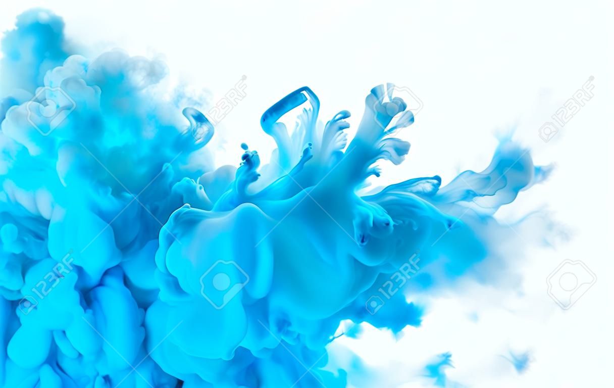 Color explosion. Closeup blue acrylic ink in water isolated on white with copy space for text