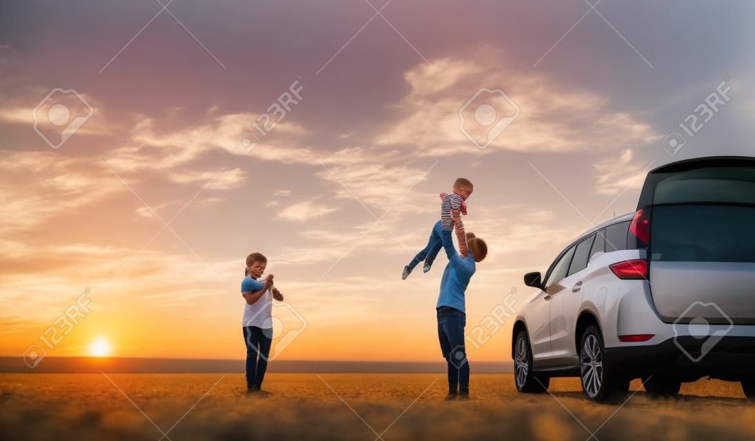 Happy Family with car travel road trip. summer vacation in car in the sunset, Dad, mom and daughter happy traveling enjoy together driving in holidays, people lifestyle ride by automobile.