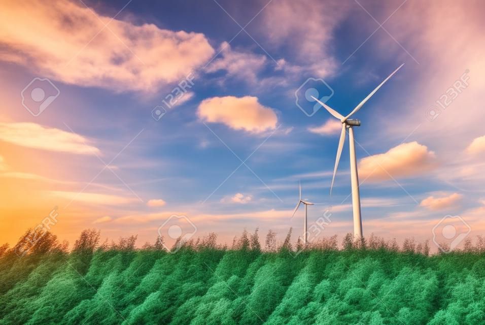 Wind turbines in the country filelds. Turbines farm.Village from drone aerial view. Beautiful village with houses and fields in Nysa, Poland. Polish farmland.