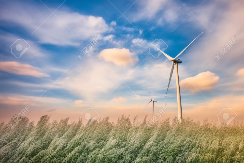 Wind turbines in the country filelds. Turbines farm.Village from drone aerial view. Beautiful village with houses and fields in Nysa, Poland. Polish farmland.