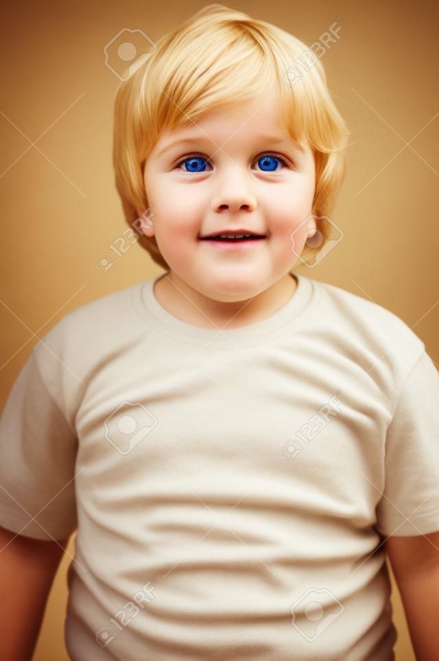closeup portrait of cute blond kid boy