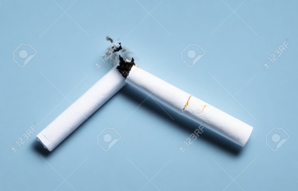 Quit smoking. Broken cigarette isolated on white background