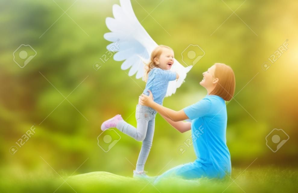 Mother and her daughter child playing together. Little girl plays in the bird. Happy loving family having fun.