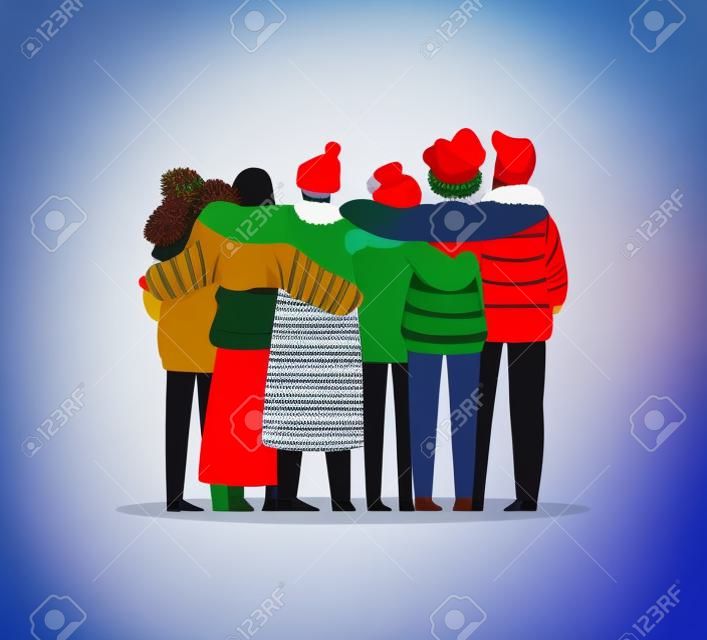Zróżnicowana grupa przyjaciół, którzy przytulają się razem w zimowych ubraniach na Boże Narodzenie lub święta. Dziewczęta i chłopcy zespół przytulić na na białym tle z miejsca na kopię.