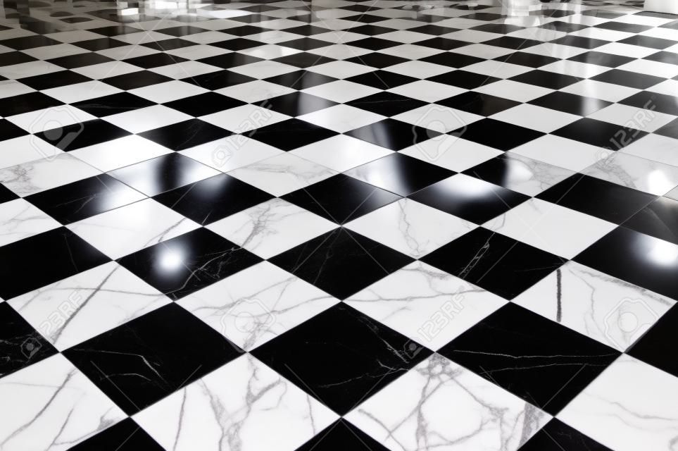 pavimento in marmo a scacchi bianco e nero con la luce del sole