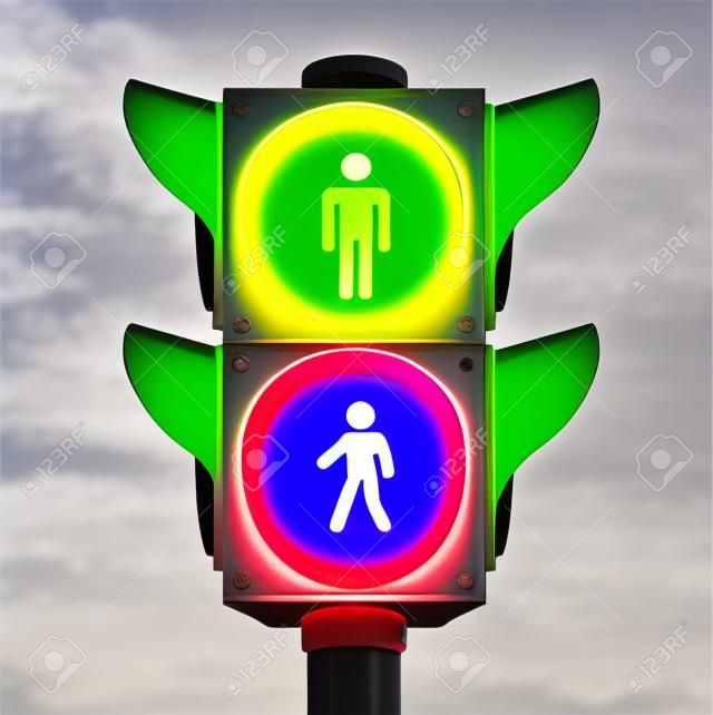 pedestrian traffic light sign with go and stop indicators on white