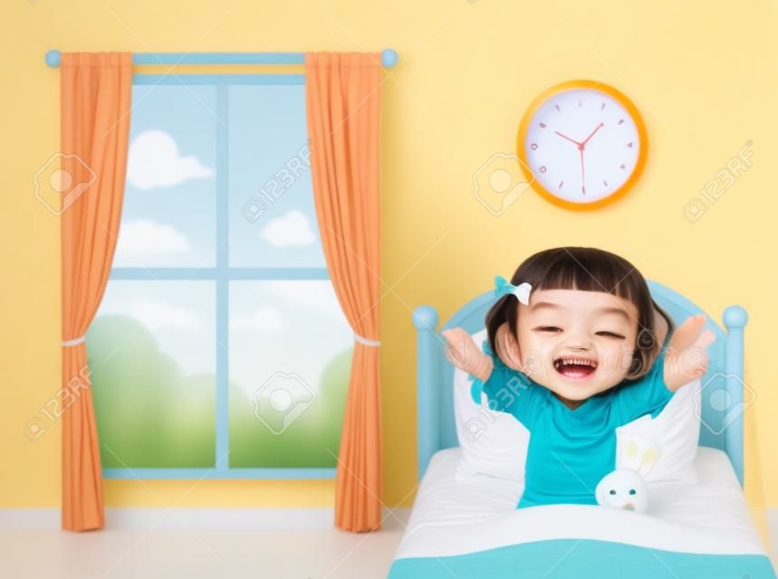 happy cute little kid girl wake up in the morning