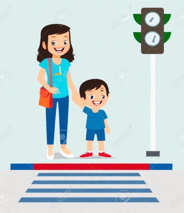glücklicher süßer kleiner Junge überquert die Straße mit Mutter