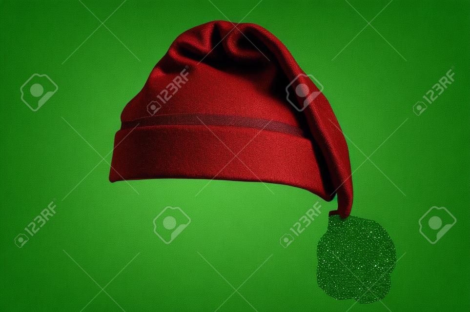 Cappello di Babbo Natale isolato su sfondo verde. progettato per facilmente mettere sulla testa delle persone.