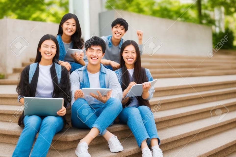 Group Of Happy Young Asian College Students In Casual Clothes.