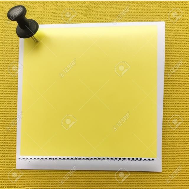 yellow sticker attached drawing pin