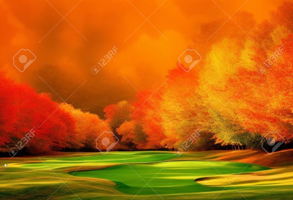 Autumn Foliage at the Golf Course - The sun shines on a putting green and lake at a golf course in Autumn.