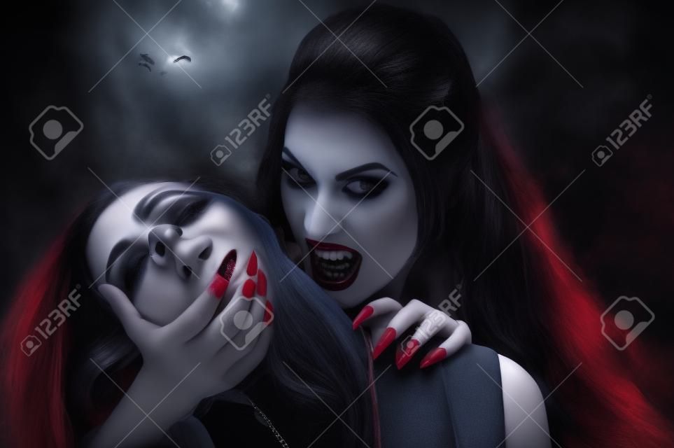 Hermosa mujer vampiro y su víctima