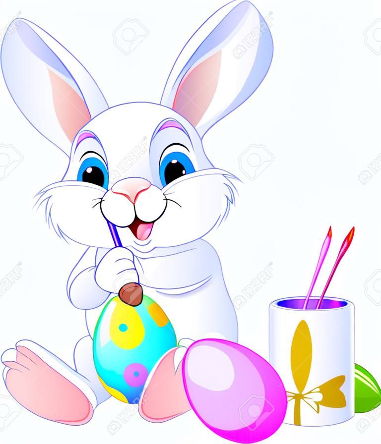 Bir yumurta boyama Sevimli Paskalya Tavşanı