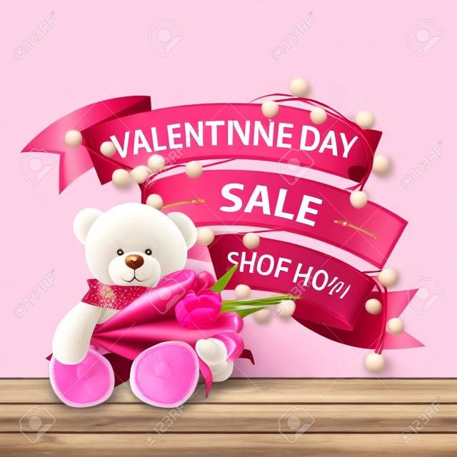 バレンタインデーセール、今すぐ購入、花輪で包まれたリボンの形のピンクの割引バナー。チューリップの花束とテディベアと孤立した割引バナー