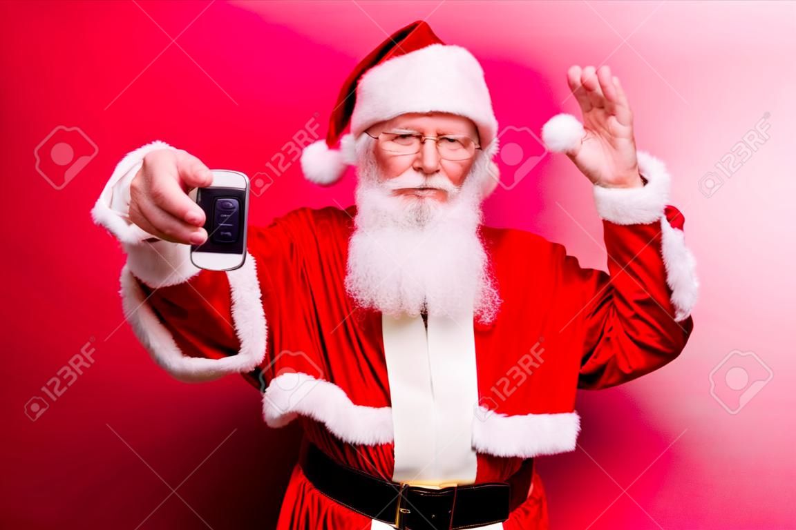Funny aged grandfather in red traditional outfit and headwear. X mas noel time! Success, happiness, surprise, dream, december, buyer, ownership, property, purchase, rent, sell, cars concept