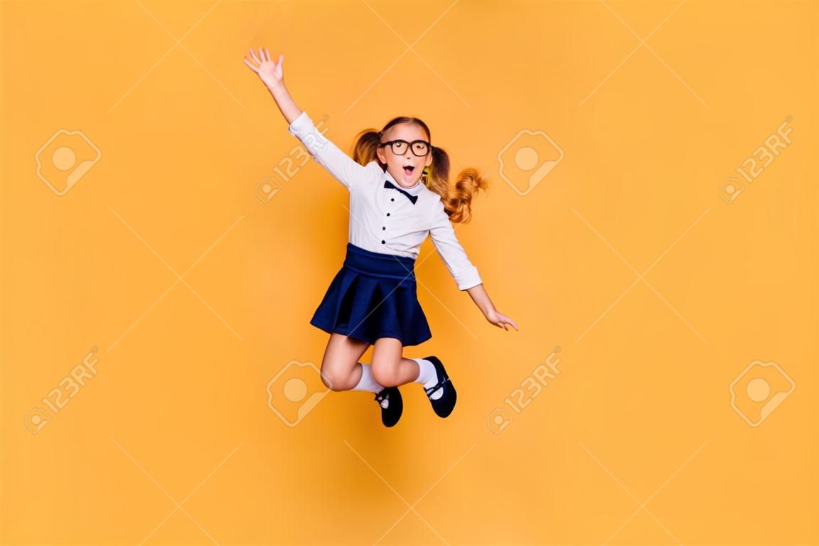 Rejoice delight enthusiasm positive laugh people person concept. Full length size studio photo of cheerful excited sweet cute clever optimistic jumping schoolchild gesturing hands isolated background
