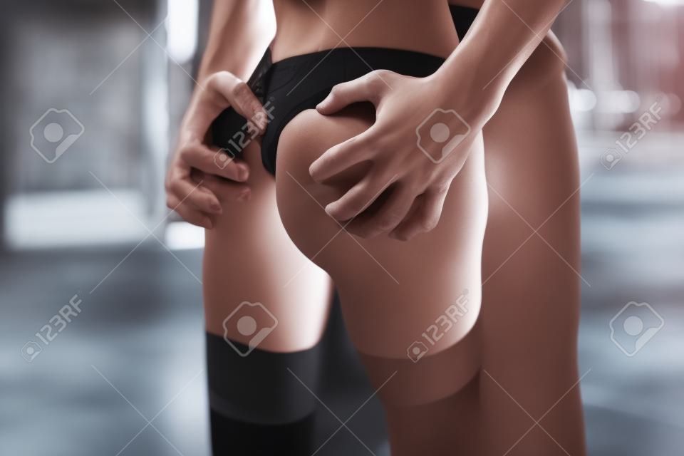 Cropped close-up view of nice attractive stunning gorgeous sporty feminine slim fit thin slender form shape figure lady passionate guy affair betrayal in loft brick industrial style interior