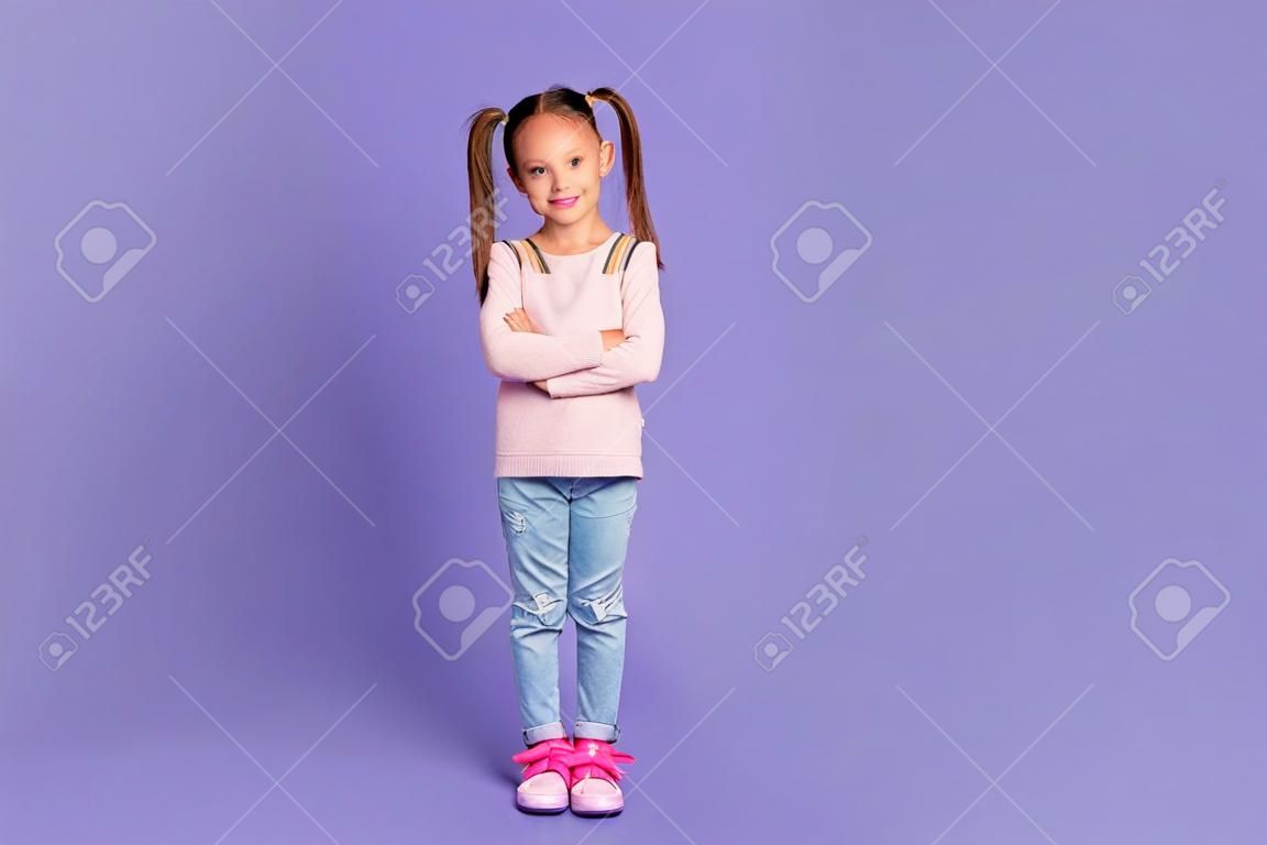 Full length photo of attractive cute schoolgirl folded arms good mood isolated on violet color background