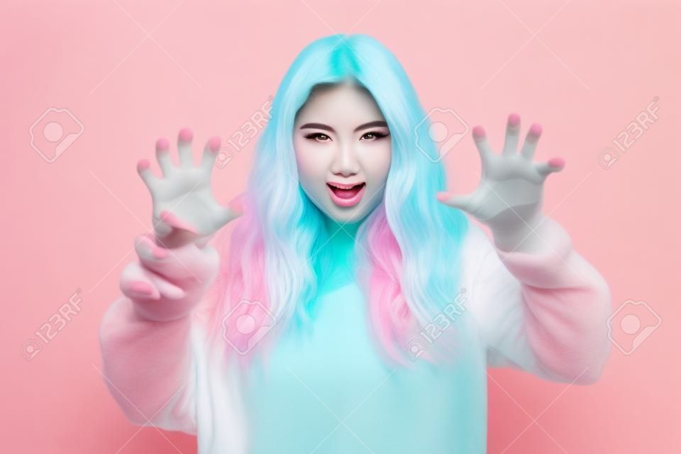 Photo of young attractive girl fooling show fingers claws growl lion isolated over pastel color background