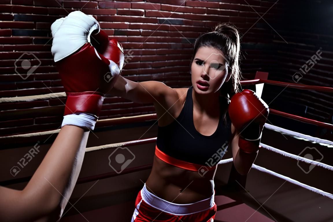 Young woman in boxing ring