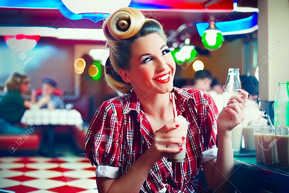 Pin-up girl in retro cafe