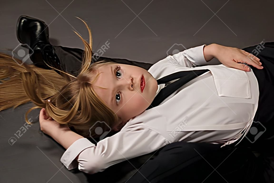 Crime scene. Strangled girl lying on a floor