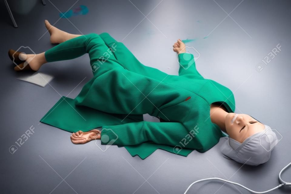 Crime scene imitation. Nurse lying on the floor