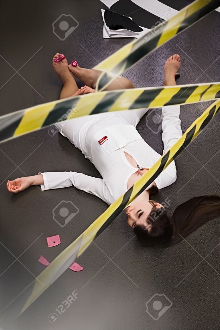 Crime scene imitation. Nurse lying on the floor