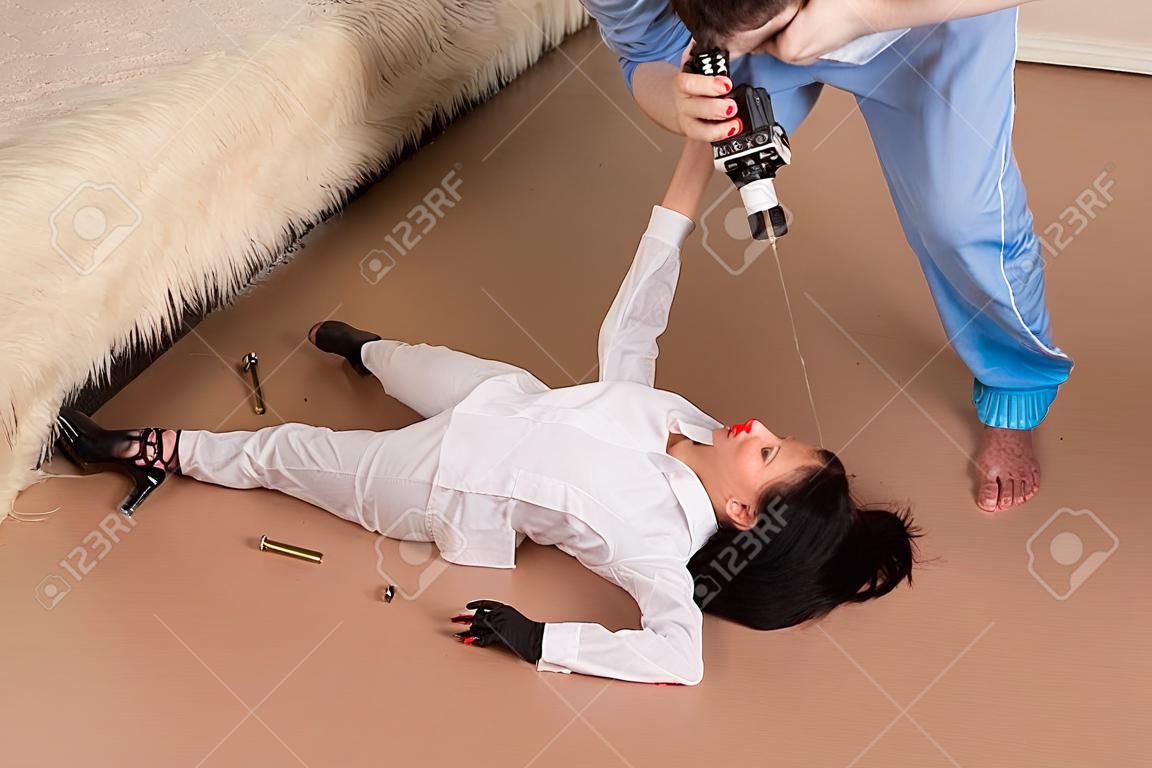 Forensic expert collecting evidence in a crime scene (imitation)