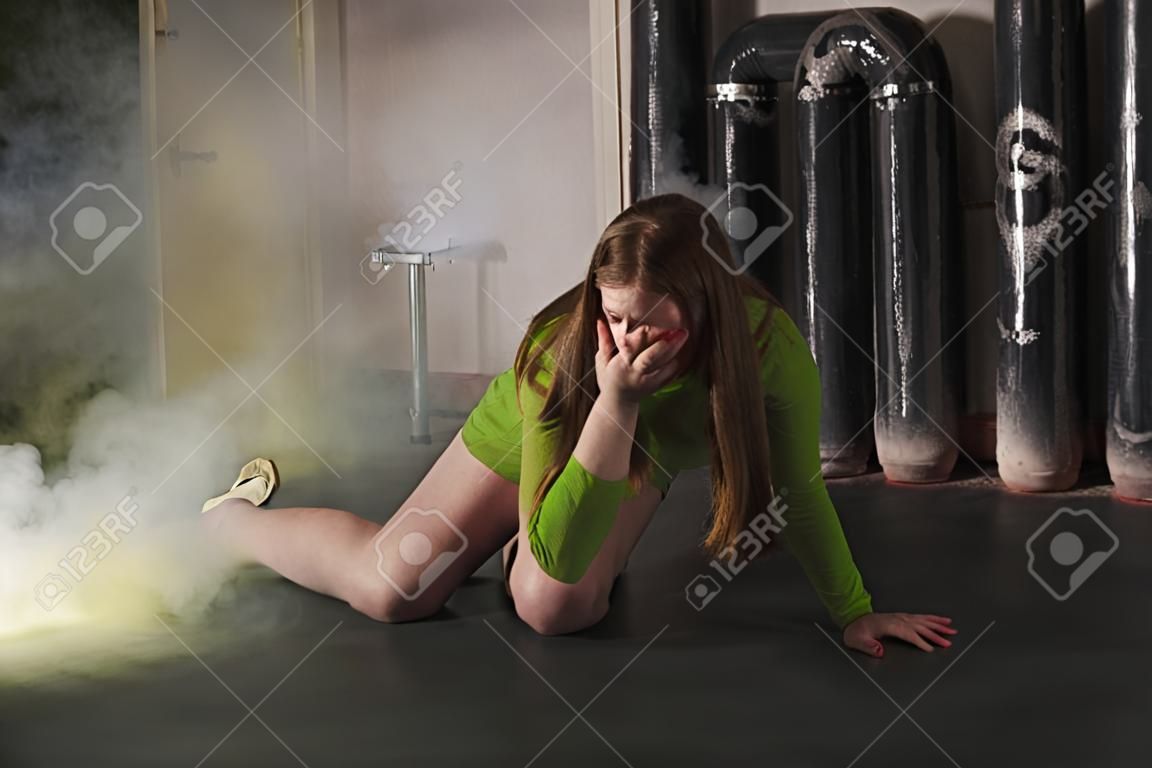 Thriller film. Girl suffocating from poisonous smoke