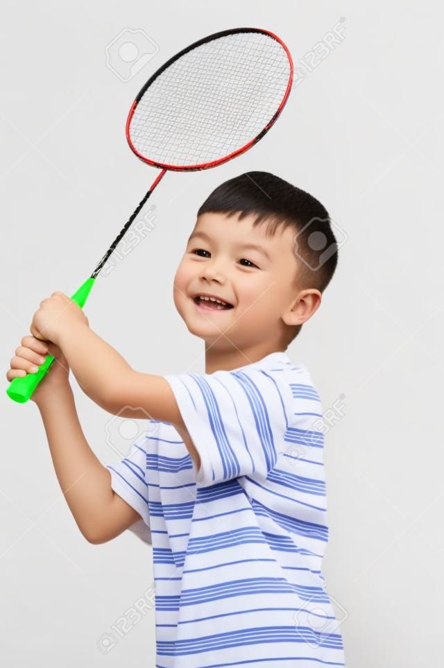 Little boy playing badminton - isolated on white background