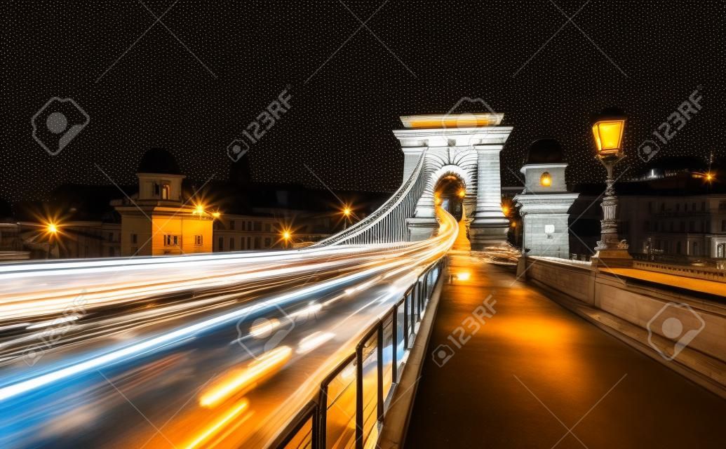 A view of Chain bridge with city traffic in old city Budapest. at night time