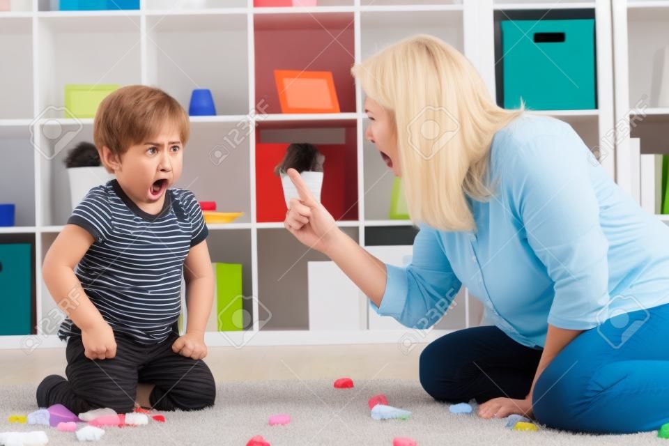 Angry mother scolding a disobedient child