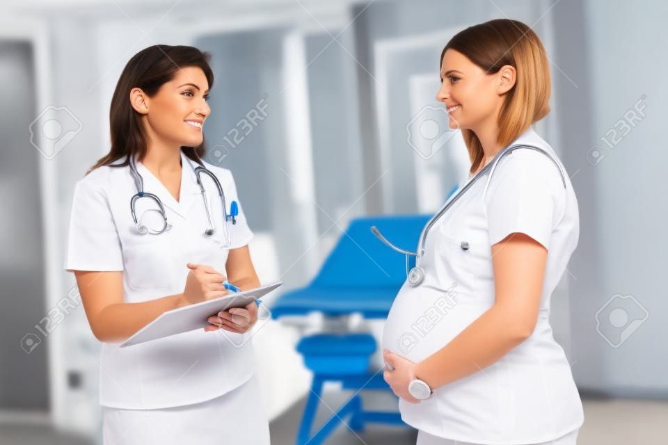 Nurse weighing pregnant woman in ambulances