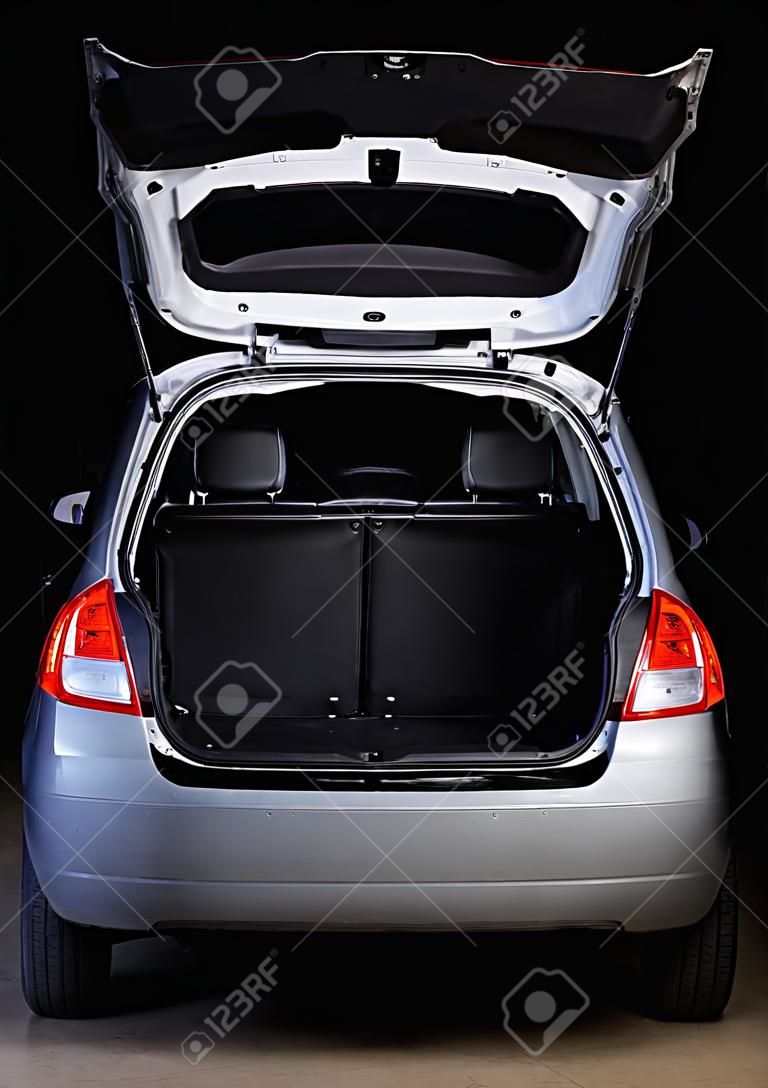 open empty  trunk of hatchback isolated on black