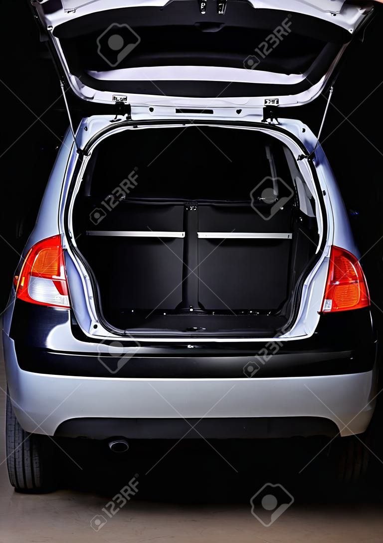 open empty  trunk of hatchback isolated on black