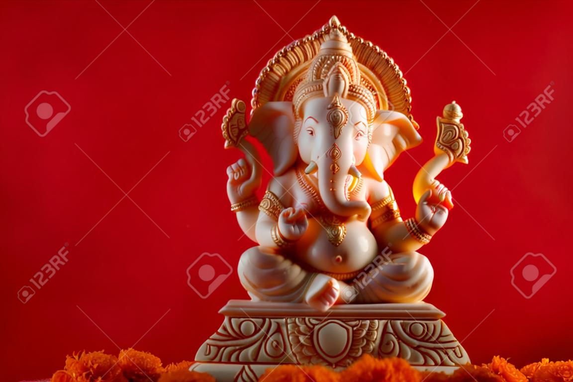 Hindu God Ganesha. Ganesha Idol on red background