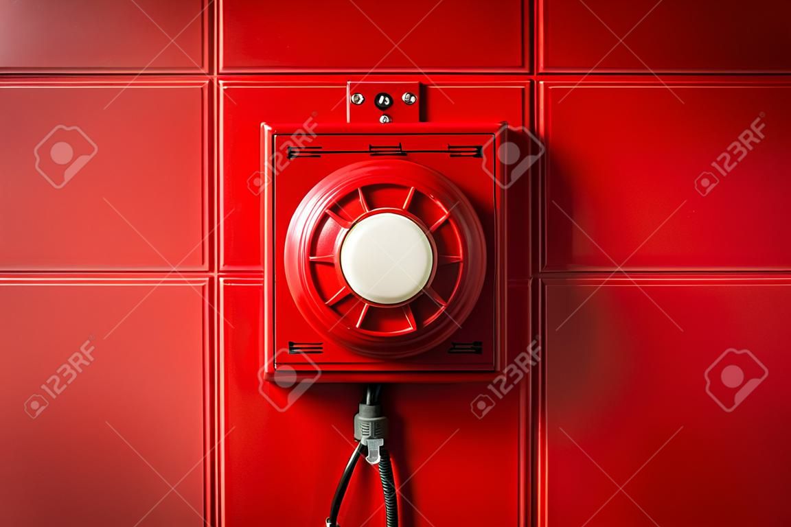 Red fire alarm button mounted