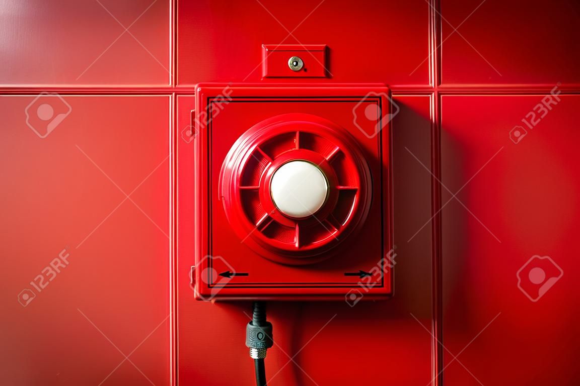 Red fire alarm button mounted