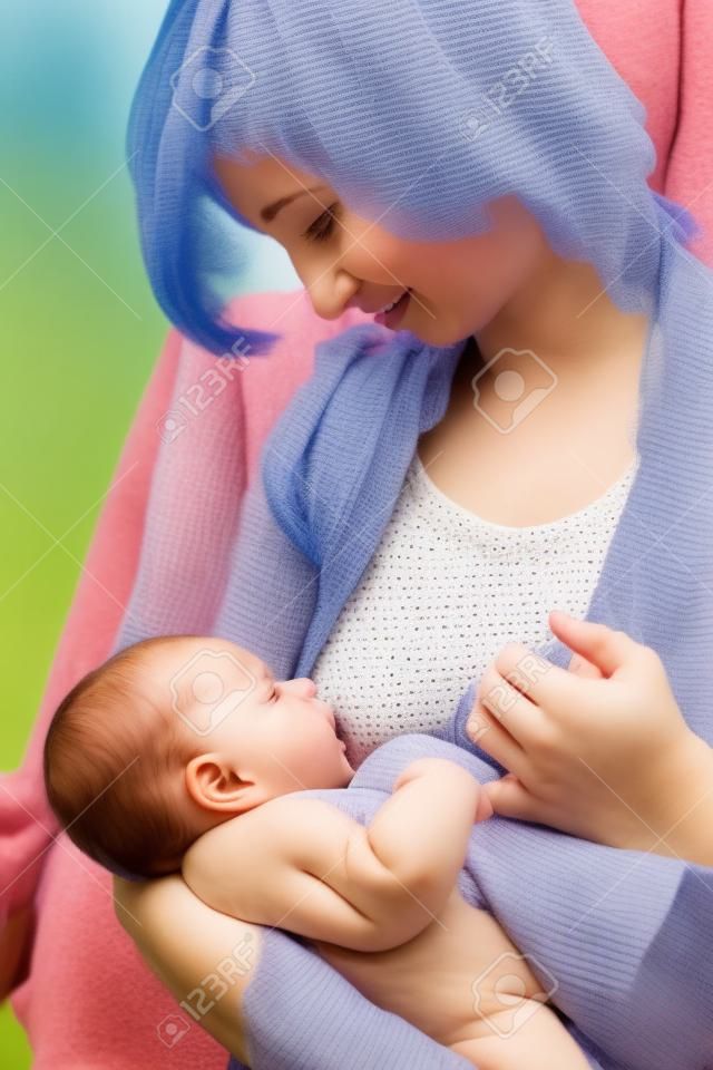 young mother feeding her baby