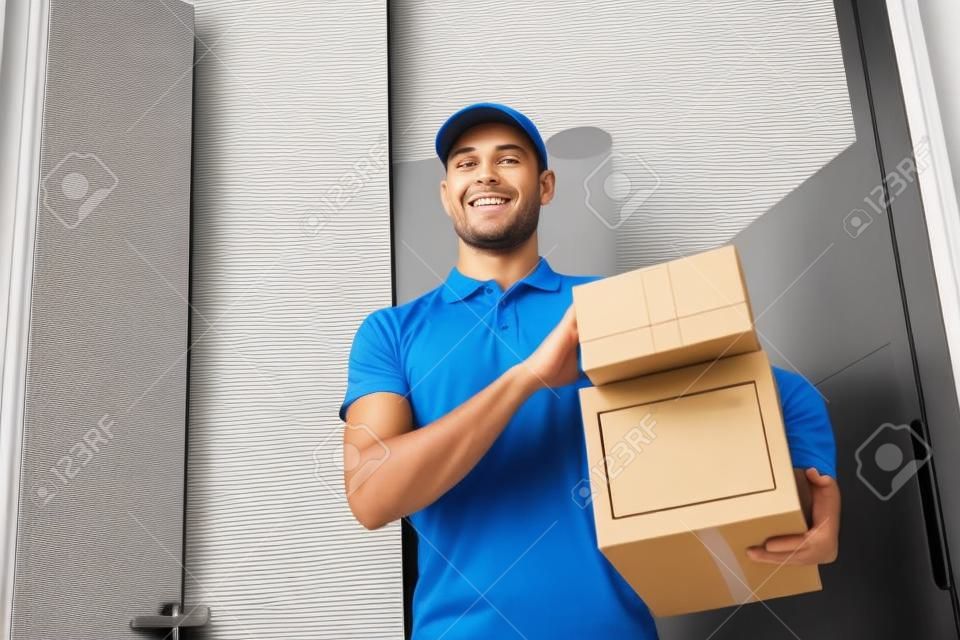 delivery man with parcel boxes at customer door