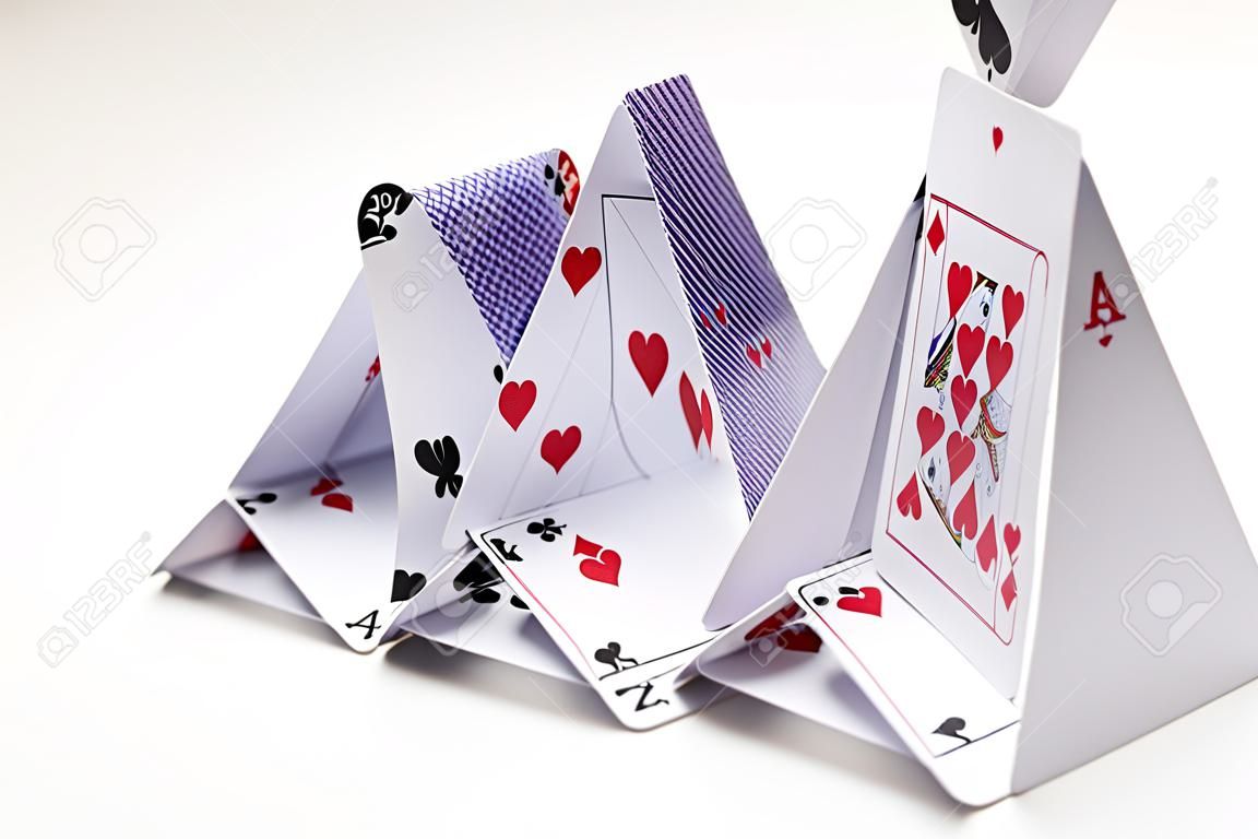 house of playing cards over white background