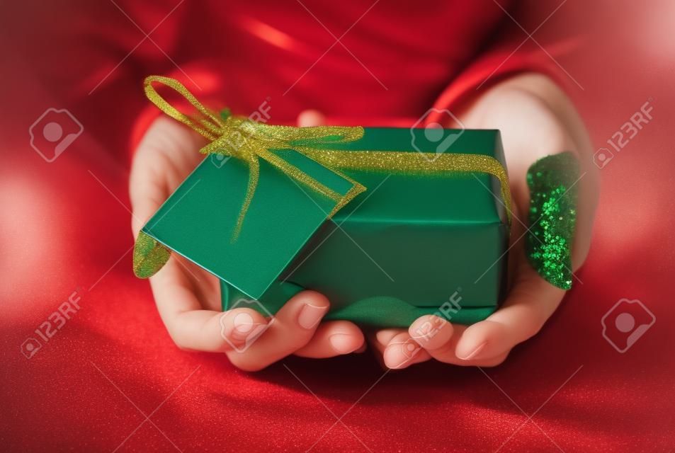 close up of woman with christmas gift or parcel
