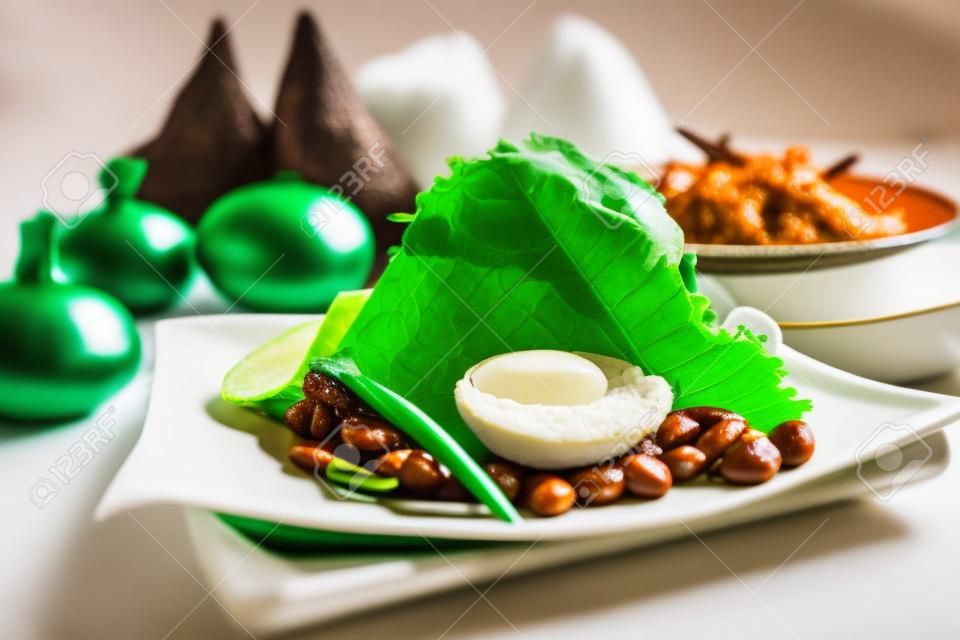 Nasi lemak is a Malay fragrant rice dish cooked in coconut milk and pandan leaf. It is commonly found in Malaysia.
