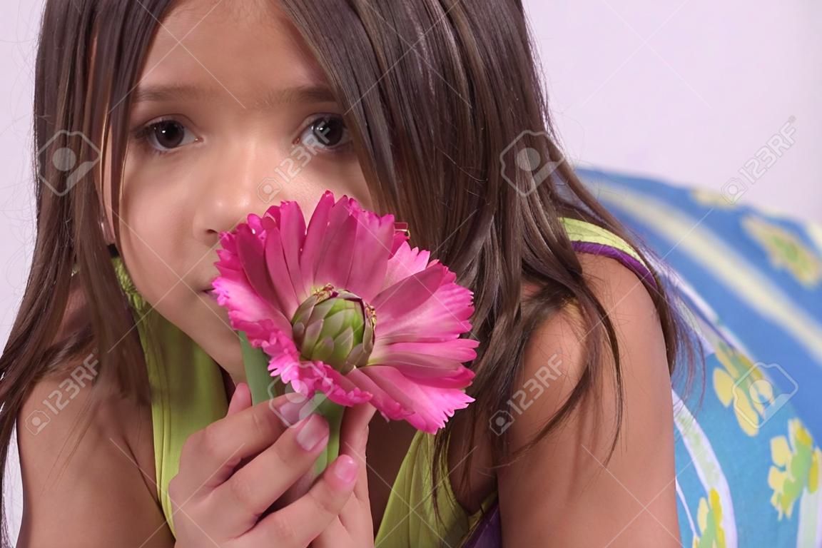 girl hiding behind flower